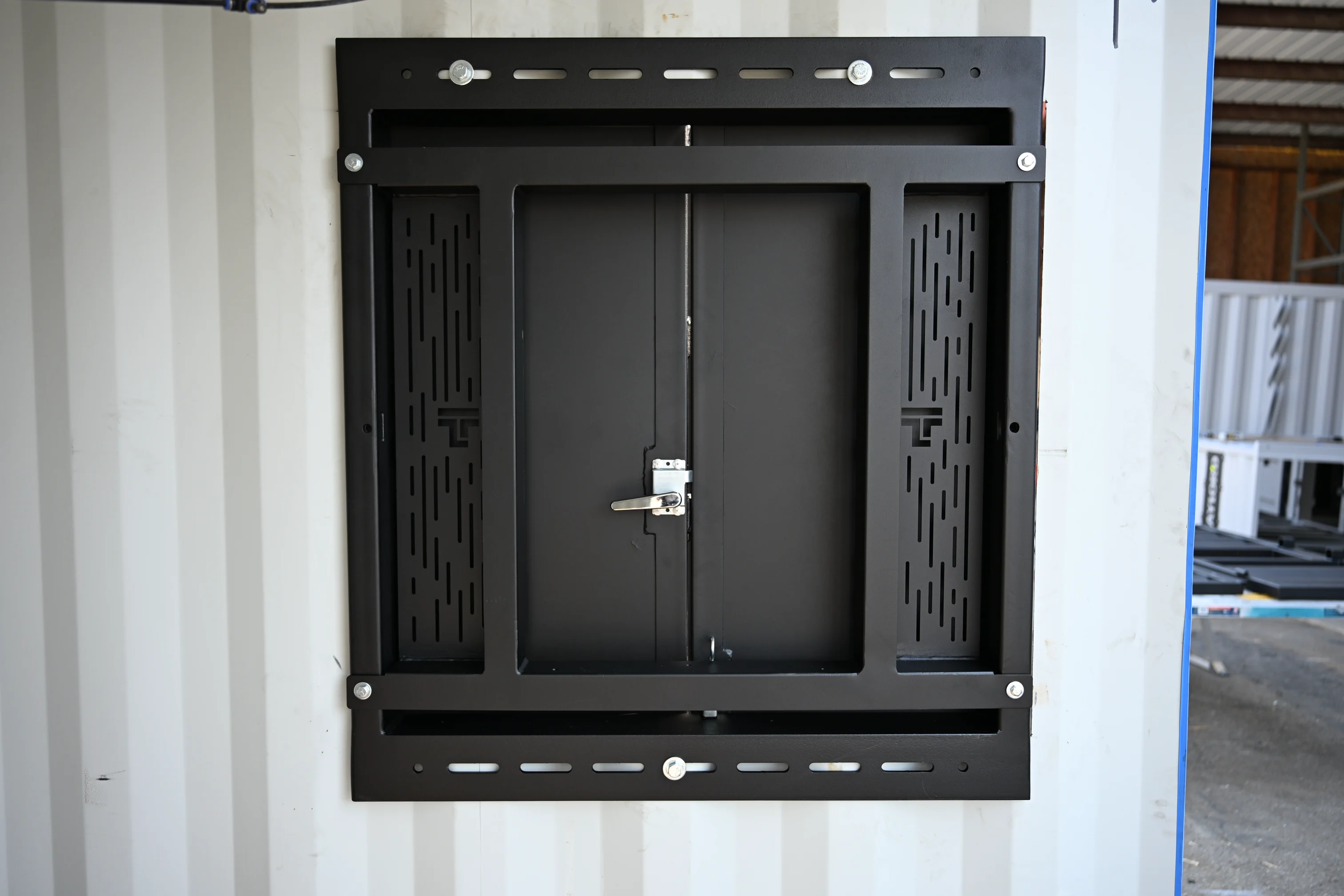 Angled view of the Taylor'd Training Window fully open on a Taylor'd container