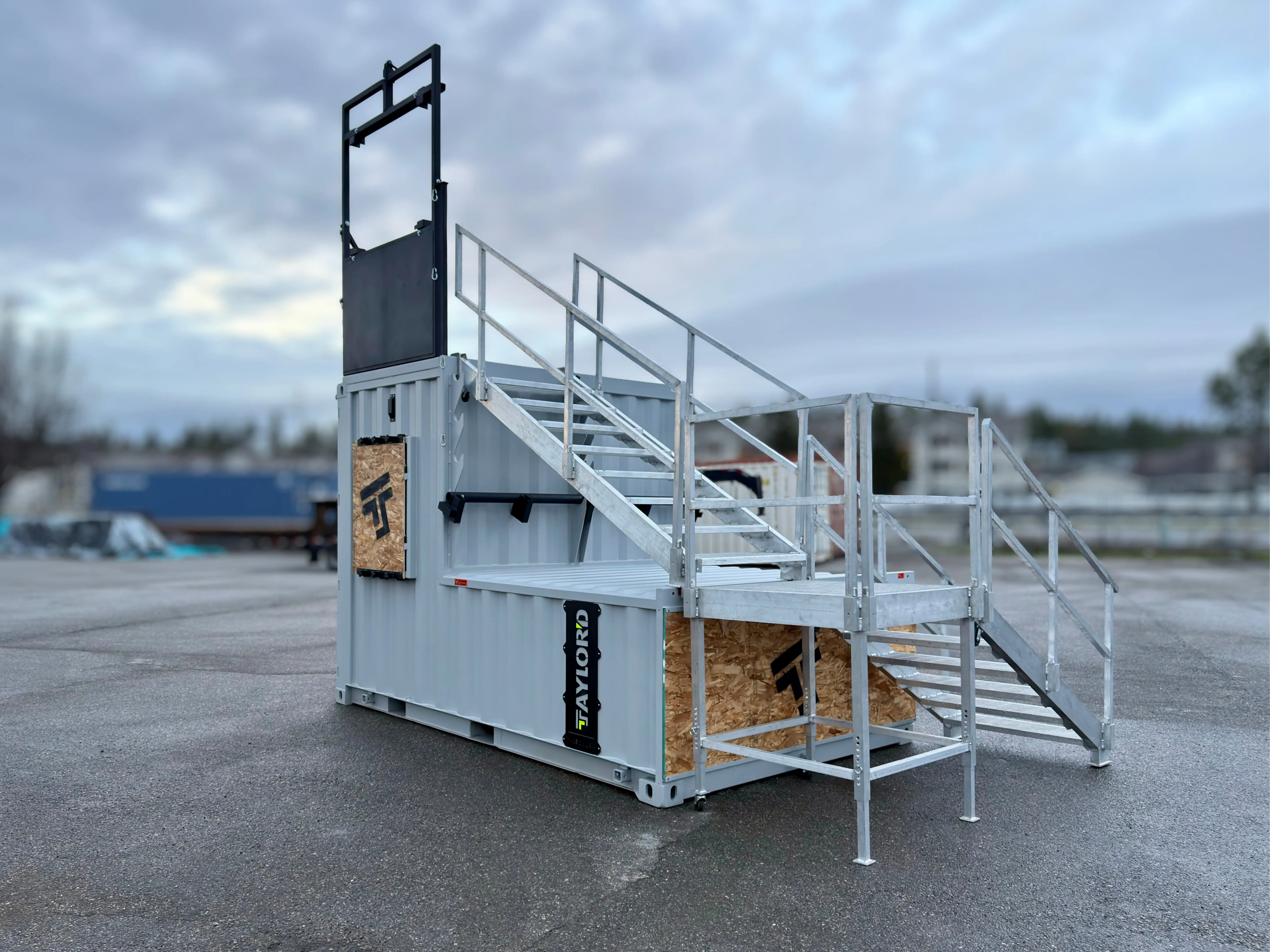 Taylor'd Series 12 firefighter training prop with the optional stairs leading to the elevated platform and bailout window