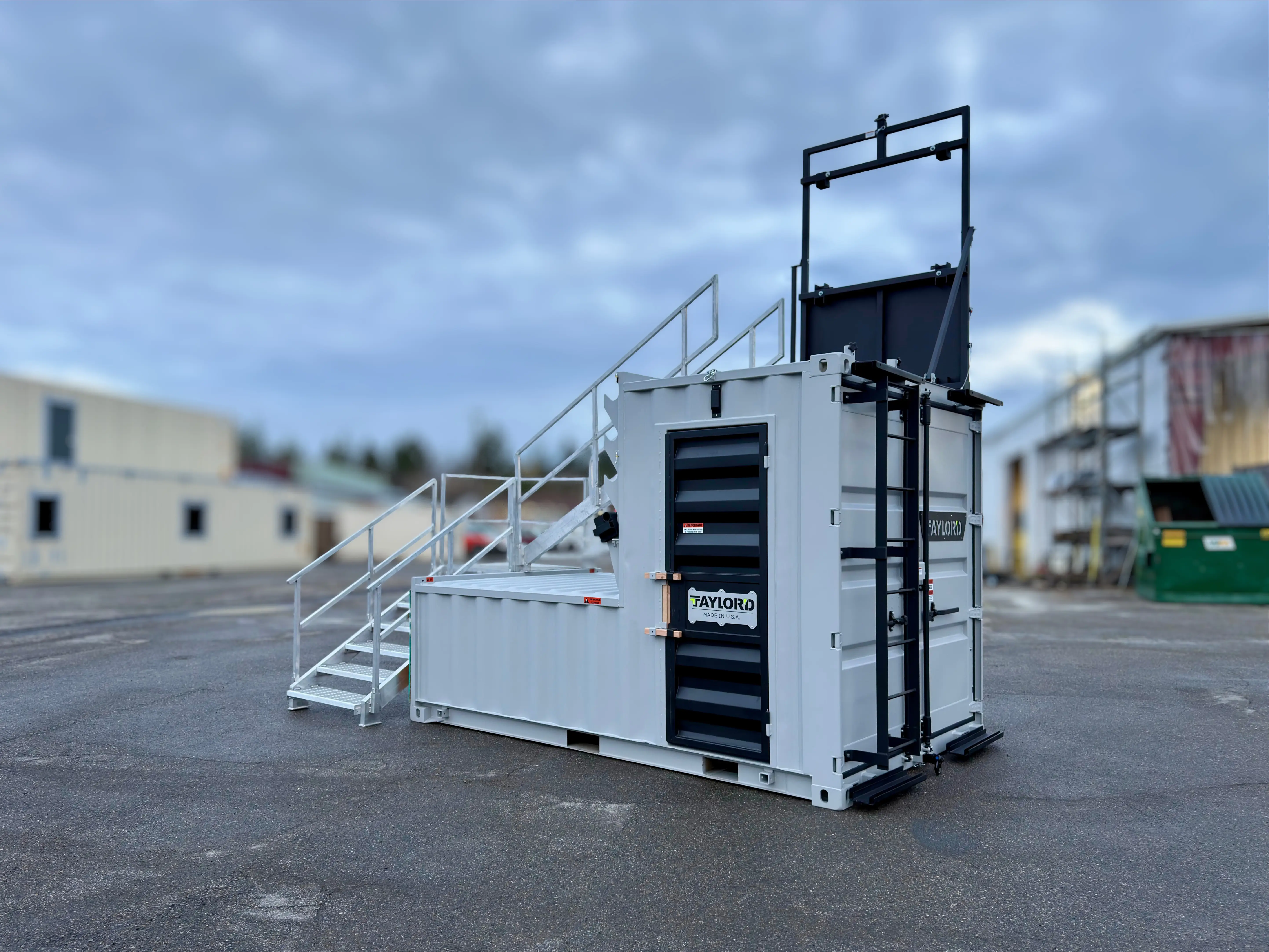 Rear quarter view of the Series 12 stair option alongside the prop's louvered doors and window system