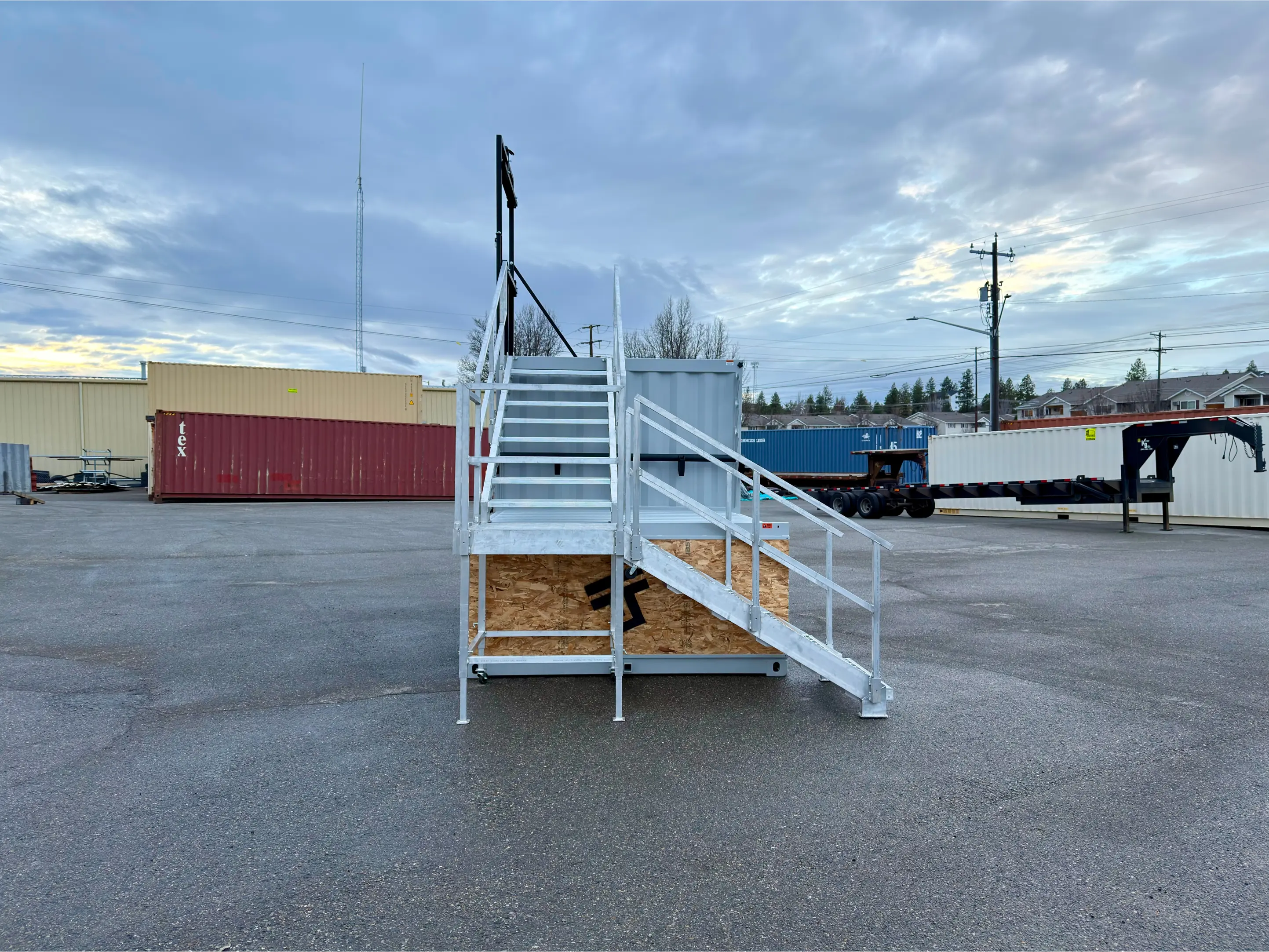 Straight-on view of the Series 12 optional stair run and guardrails at a fire department training site